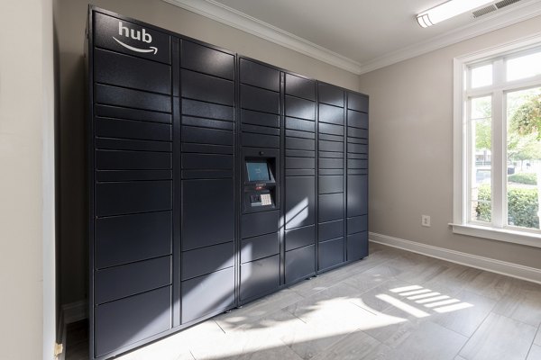 Modern mail room with secure package lockers at Windsor at Tryon Village Apartments