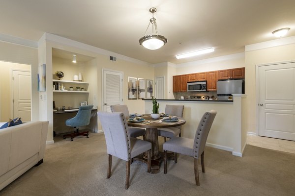 Dining area with elegant furnishings at Windsor at Tryon Village Apartments, showcasing modern luxury and style in a comfortable setting