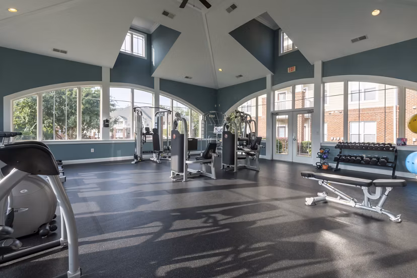 Windsor at Tryon Village: Modern fitness center with state-of-the-art equipment, providing a luxury workout experience for residents