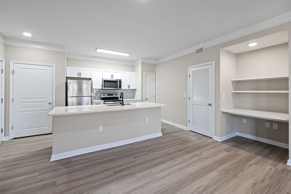 Elegant open-concept kitchen with stainless steel appliances in Windsor at Tryon Village Apartments
