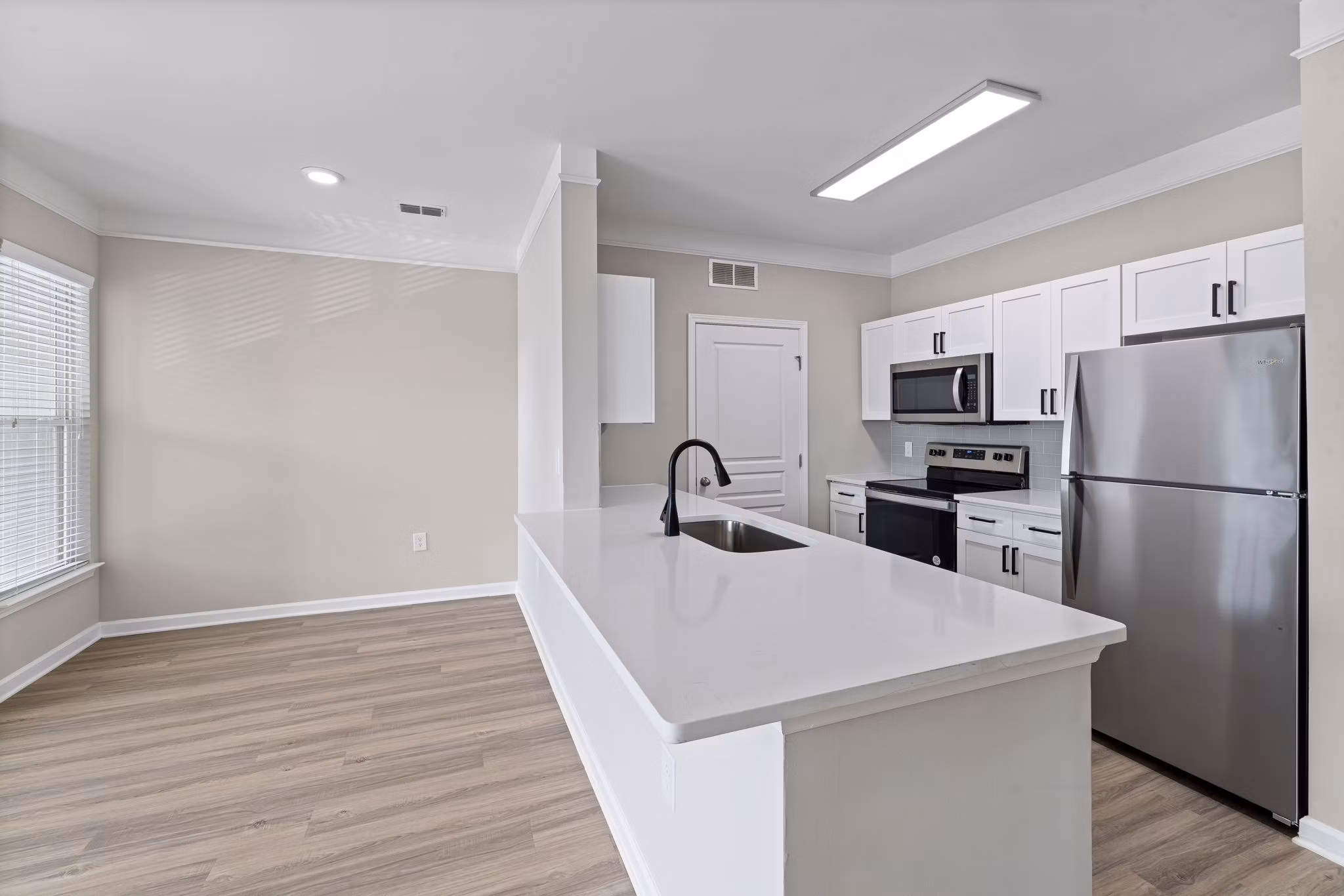 Modern kitchen with stainless steel appliances at Windsor at Tryon Village Apartments