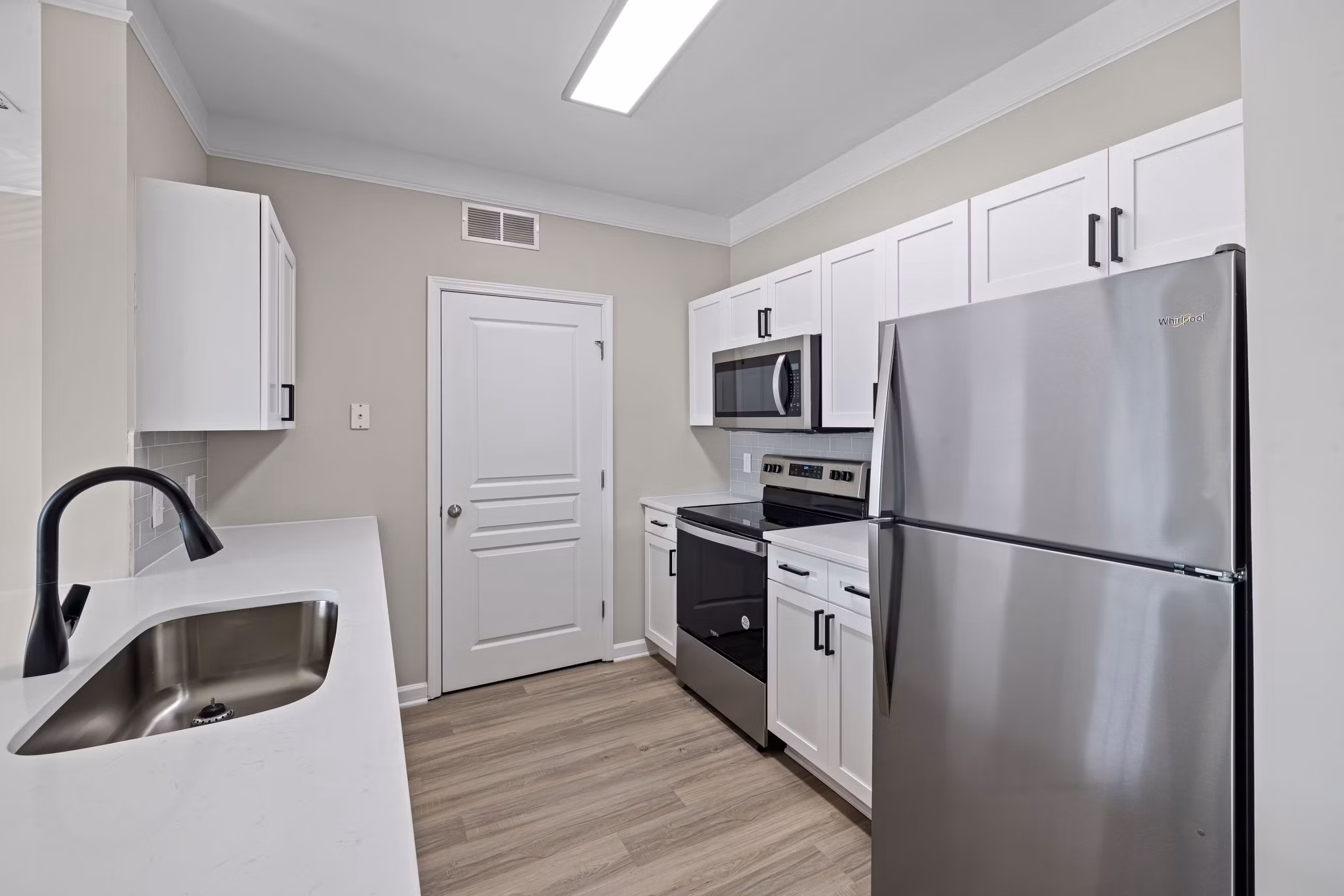 Spacious kitchen with stainless steel appliances at Windsor at Tryon Village luxury apartments