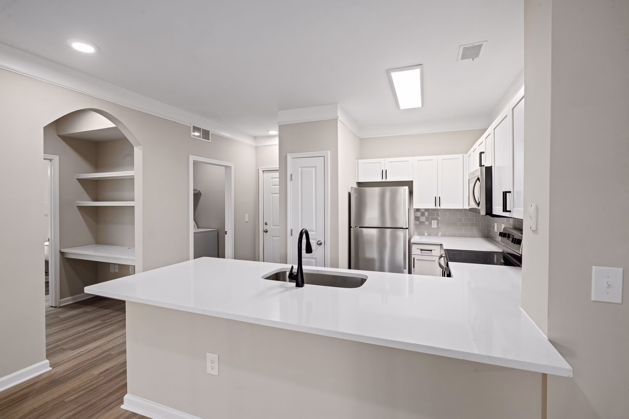 Kitchens with modern appliances and granite countertops in Windsor at Tryon Village Apartments