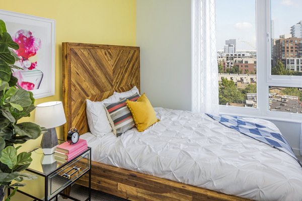 Elegant bedroom with modern furnishings at Dianne Apartments, offering luxury comfort in a premium location