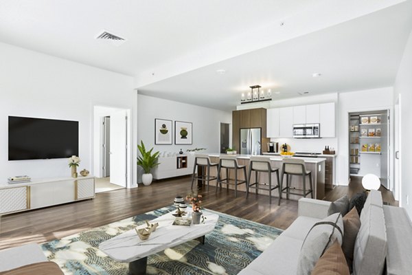 Modern living room with large windows and chic decor at Dianne Apartments, luxurious city living