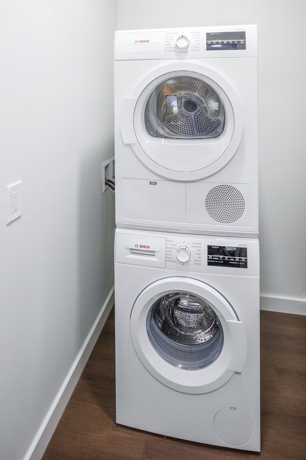 Laundry room featuring modern appliances at Dianne Apartments with efficient layout and convenient space for residentsâ€™ needs