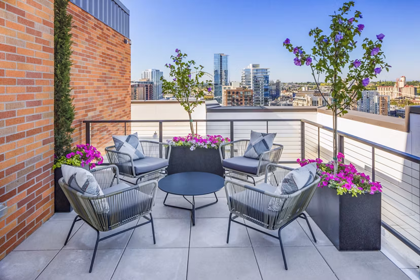 Chic patio with modern seating and urban views at Dianne Apartments