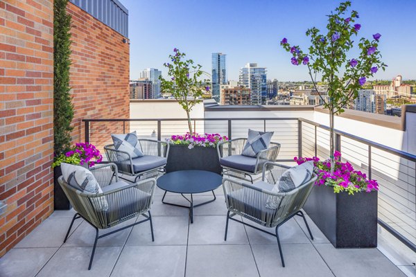 Chic patio with modern seating and urban views at Dianne Apartments