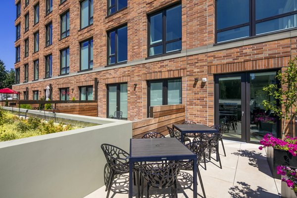Elegant patio with seating area at Dianne Apartments, a luxurious Greystar community