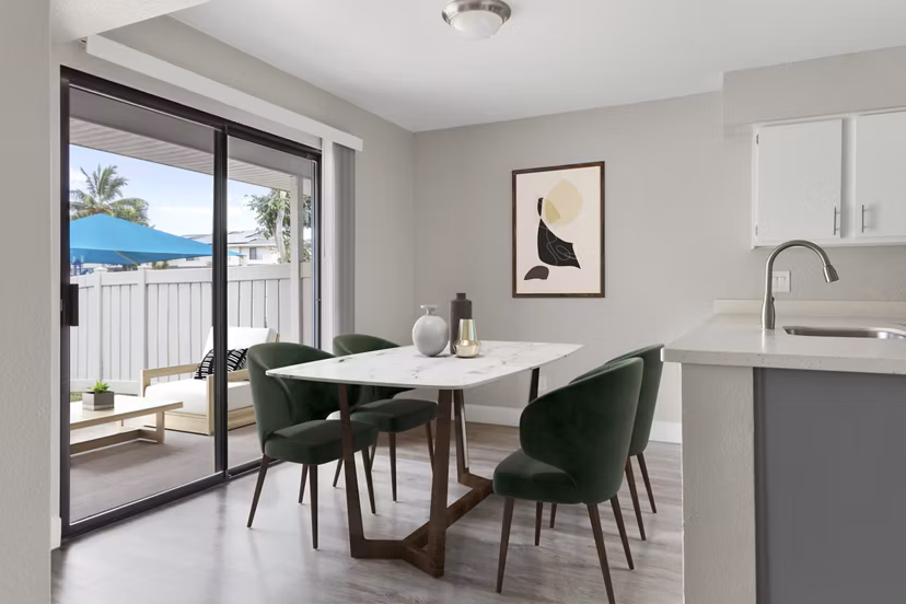 Dining area with contemporary decor in Kalaeloa Rental Homes, featuring stylish lighting and modern furnishings, perfect for luxury living