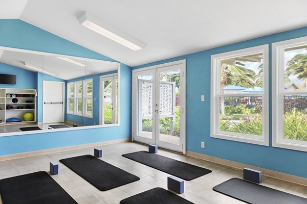 Yoga studio with spin bikes at Kalaeloa Rental Homes, offering fitness amenities for a healthy lifestyle