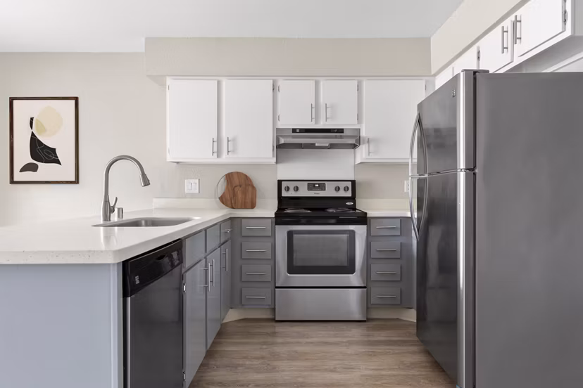 Modern kitchen with stainless steel appliances in Kalaeloa Rental Homes