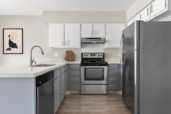 Modern kitchen with stainless steel appliances in Kalaeloa Rental Homes