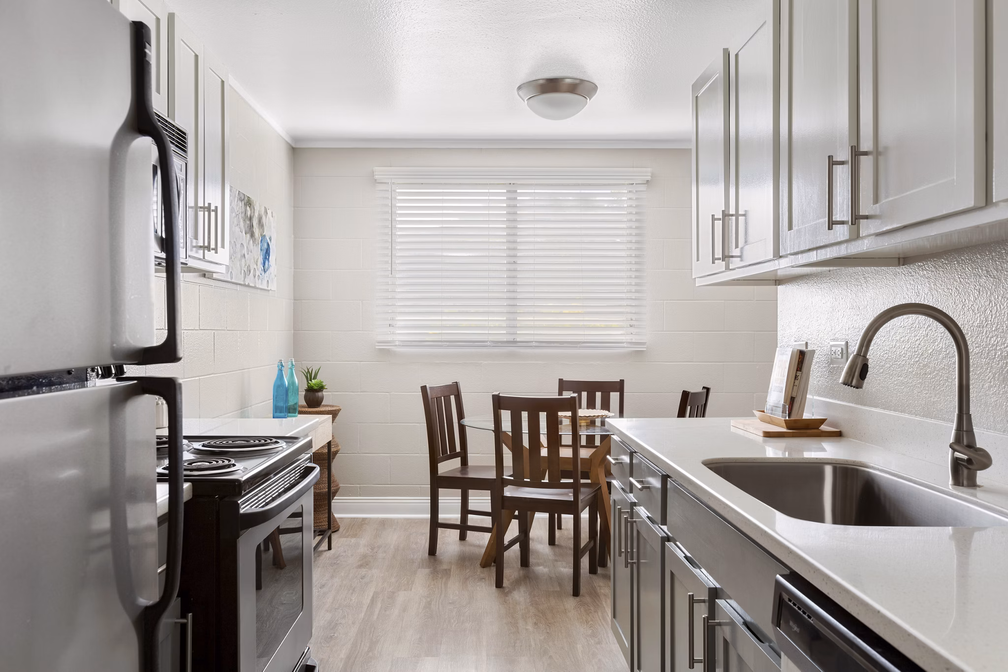 Modern kitchen with stainless steel appliances in Kalaeloa Rental Homes luxury apartments