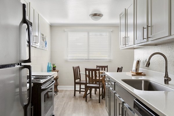 Modern kitchen with stainless steel appliances in Kalaeloa Rental Homes luxury apartments