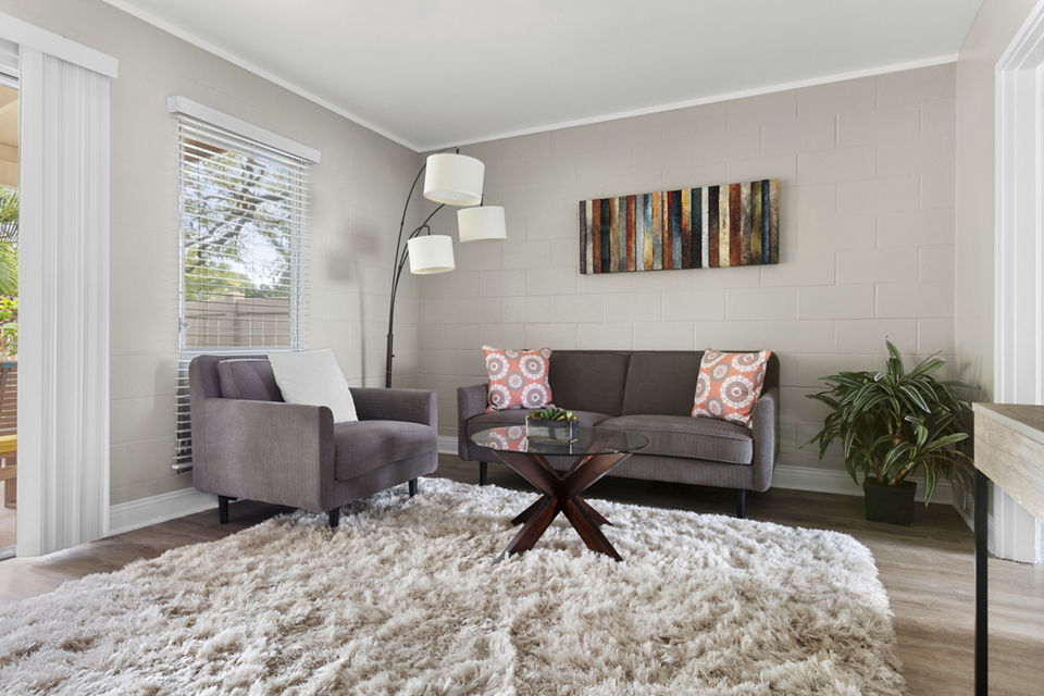 Bright living room with modern furnishings at Kalaeloa Rental Homes, offering luxury apartment living in a tranquil setting