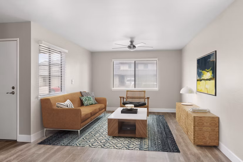 Cozy living room with plush seating and natural light in Kalaeloa Rental Homes