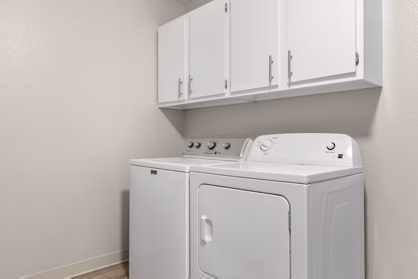 Laundry room featuring modern appliances at Kalaeloa Rental Homes