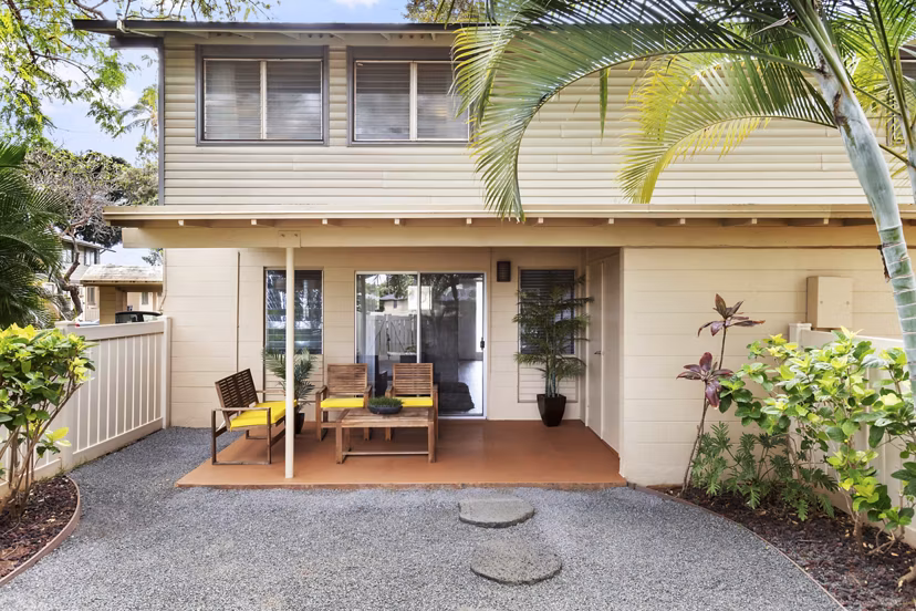 Outdoor patio at Kalaeloa Rental Homes with comfortable seating and lush landscaping