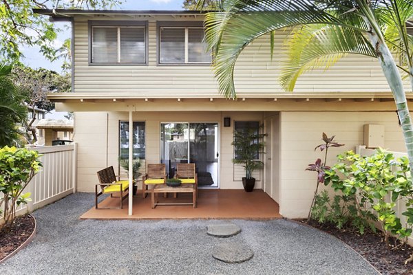 Outdoor patio at Kalaeloa Rental Homes with comfortable seating and lush landscaping