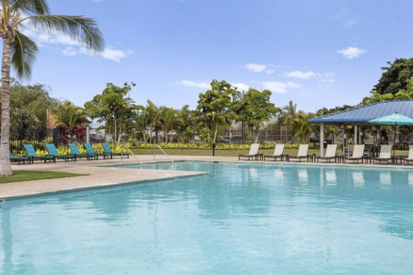 Luxurious swimming pool at Kalaeloa Rental Homes offering serene relaxation ambiance, a perfect escape in sunny Hawaii