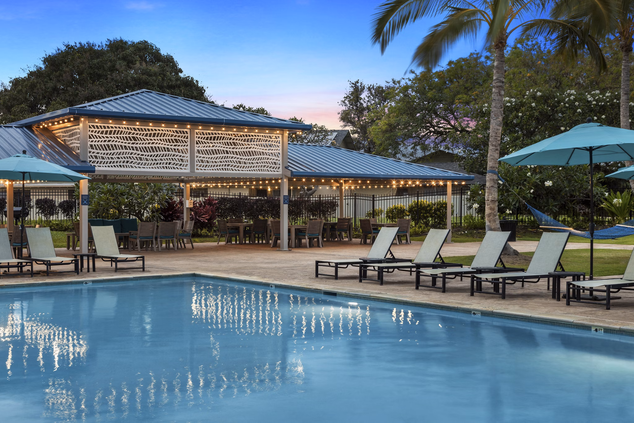 Family-friendly pool at Kalaeloa Rental Homes, offering a relaxing and inviting atmosphere for residents