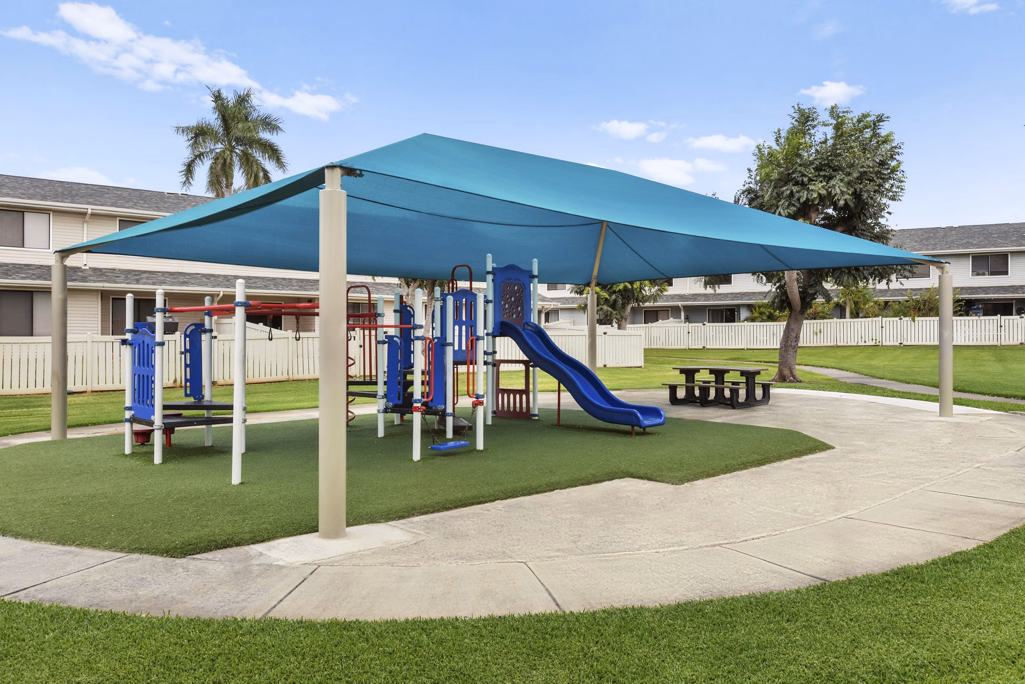 Children's playground with modern equipment at Kalaeloa Rental Homes