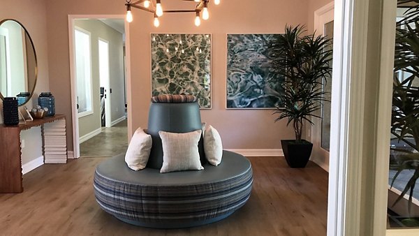 Vibrant clubhouse with elegant seating and decor at Cape May at Harveston Apartments in a luxury setting