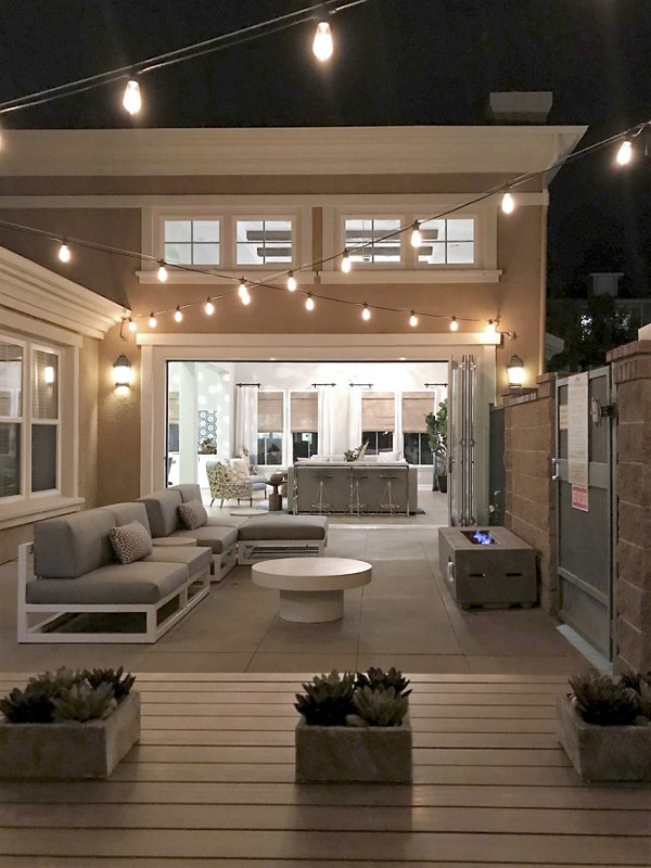 Cozy outdoor fire pit area at Cape May at Harveston Apartments, perfect for gatherings and relaxation