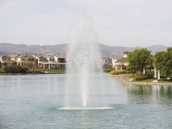 Cape May at Harveston: Serene pond view at luxury apartments in Temecula, California