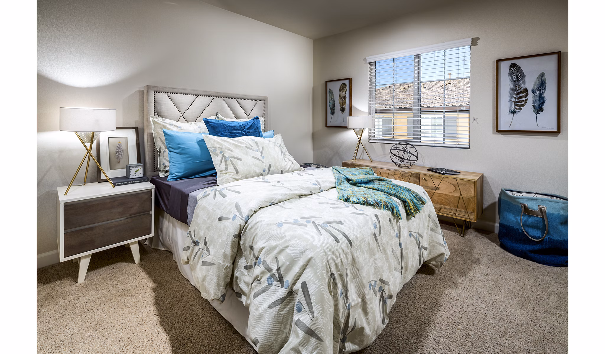 Cozy bedroom featuring elegant decor and ample sunlight at Townhomes at Lost Canyon Apartments