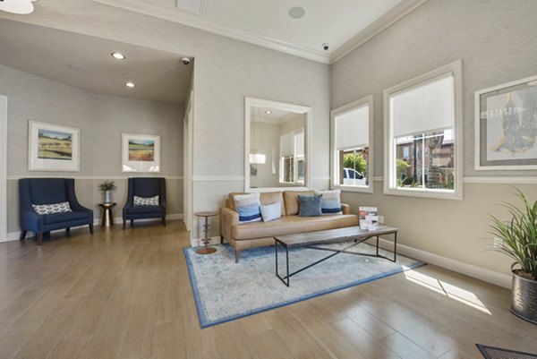 Clubhouse featuring modern design and communal seating at Townhomes at Lost Canyon Apartments