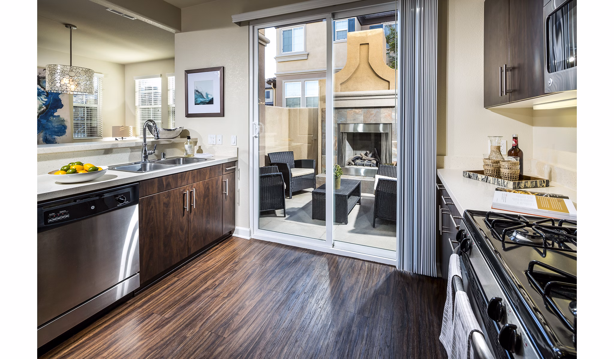 Modern kitchen with stainless steel appliances at Townhomes at Lost Canyon Apartments