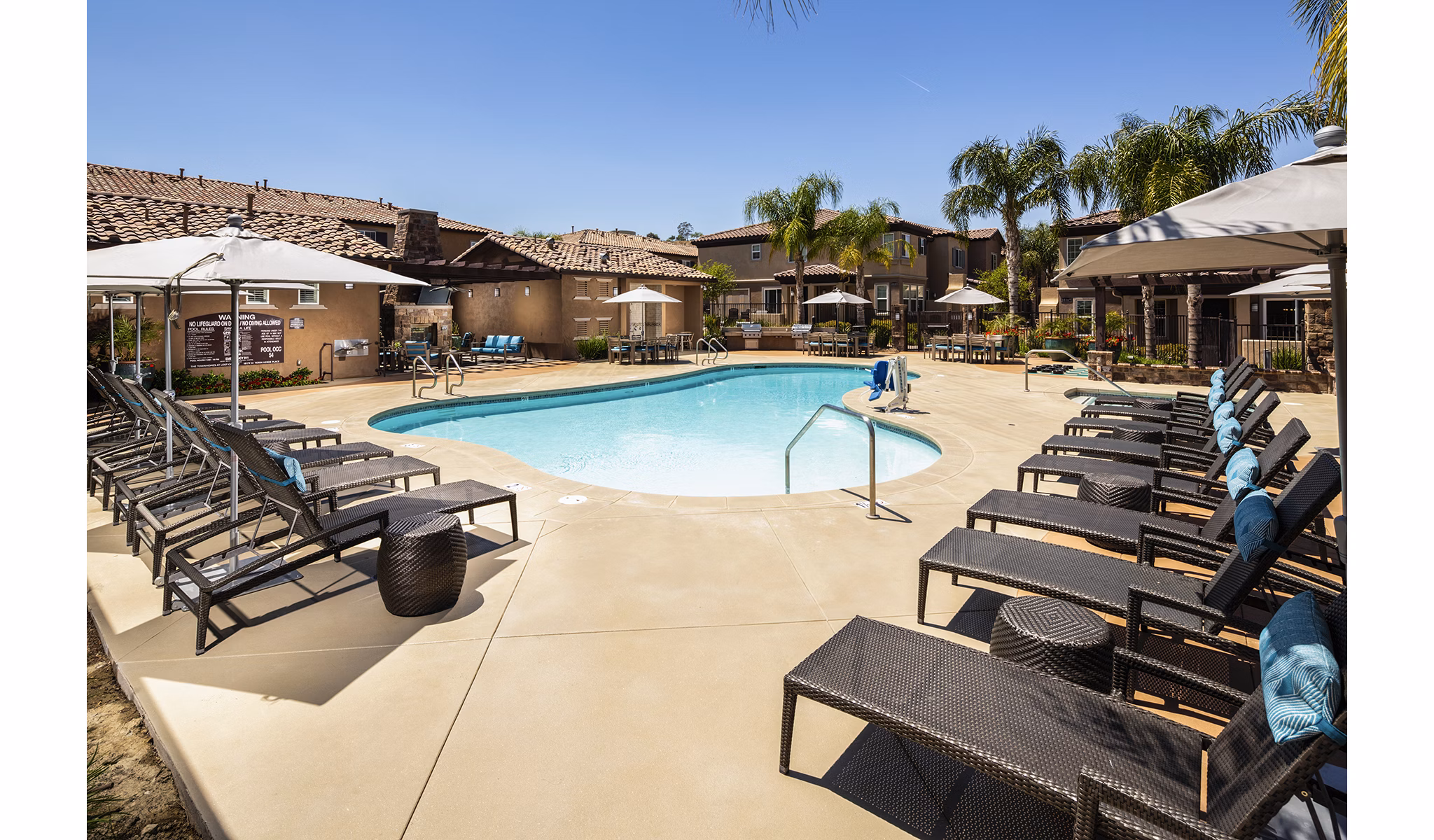 Inviting pool area at Townhomes at Lost Canyon Apartments offering relaxing aquatic recreation