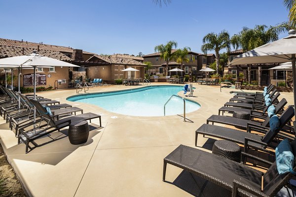 Inviting pool area at Townhomes at Lost Canyon Apartments offering relaxing aquatic recreation