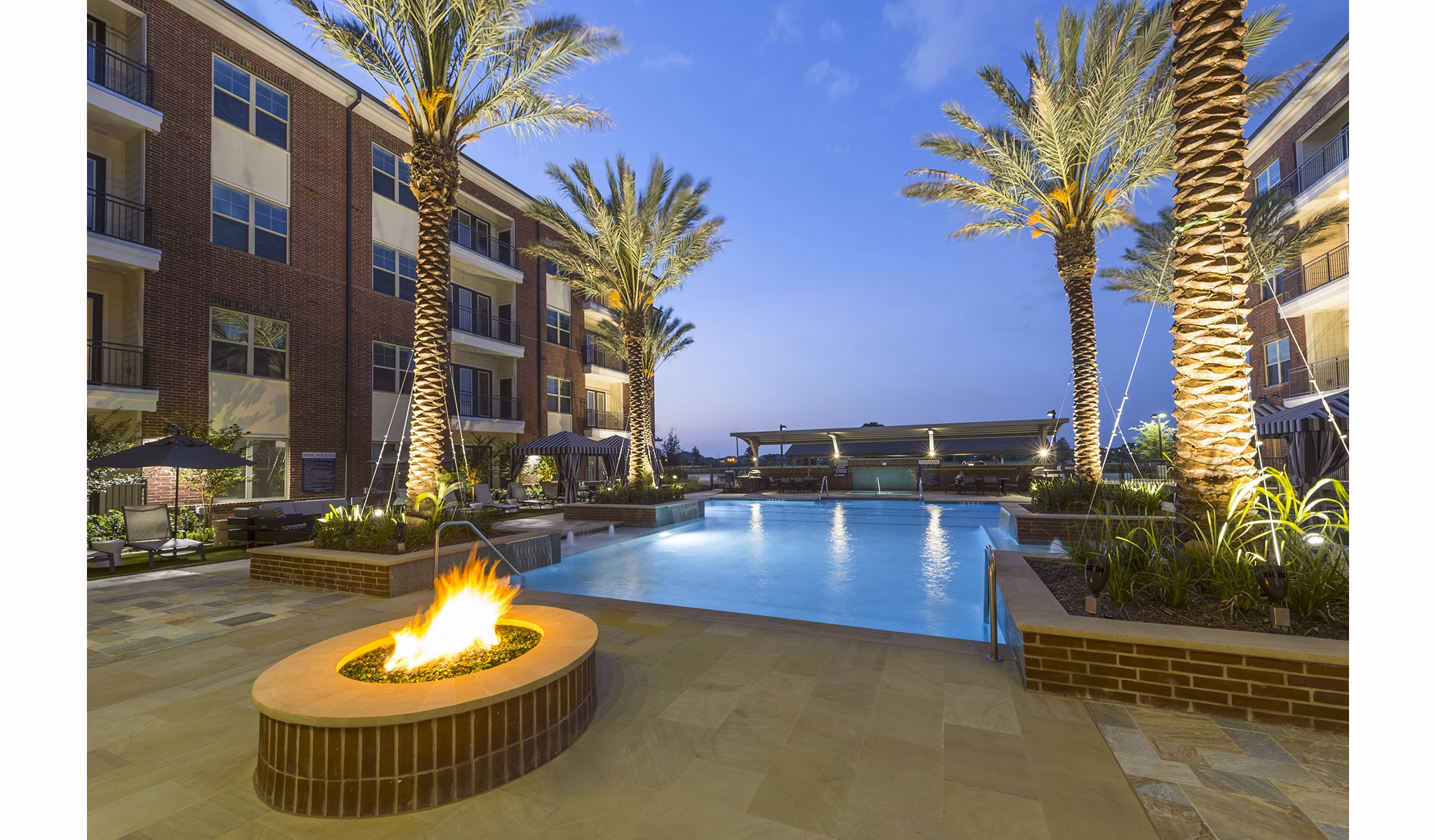 Inviting pool with lounge chairs at Overture Sugar Land, luxury apartments offering a relaxing outdoor amenity