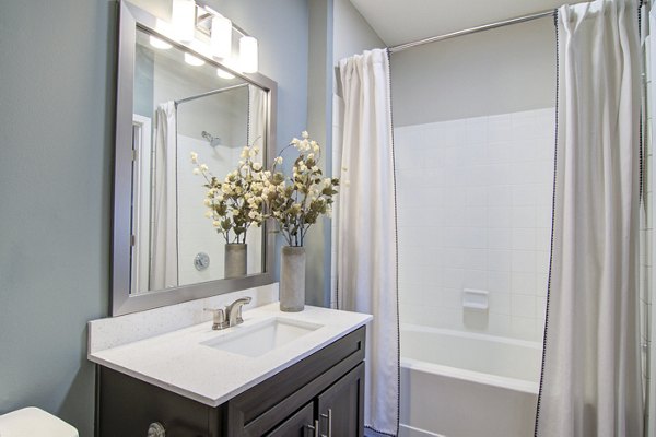Contemporary bathroom with sleek fixtures at Avana North Point Apartments