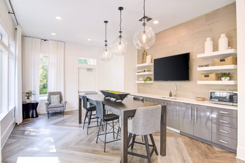 Clubhouse featuring modern decor and spacious seating at Avana North Point Apartments