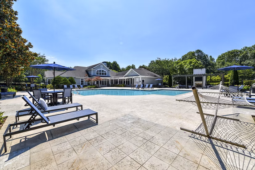 Inviting pool with lounge chairs at Avana North Point Apartments, offering a relaxing retreat at luxury Greystar residences
