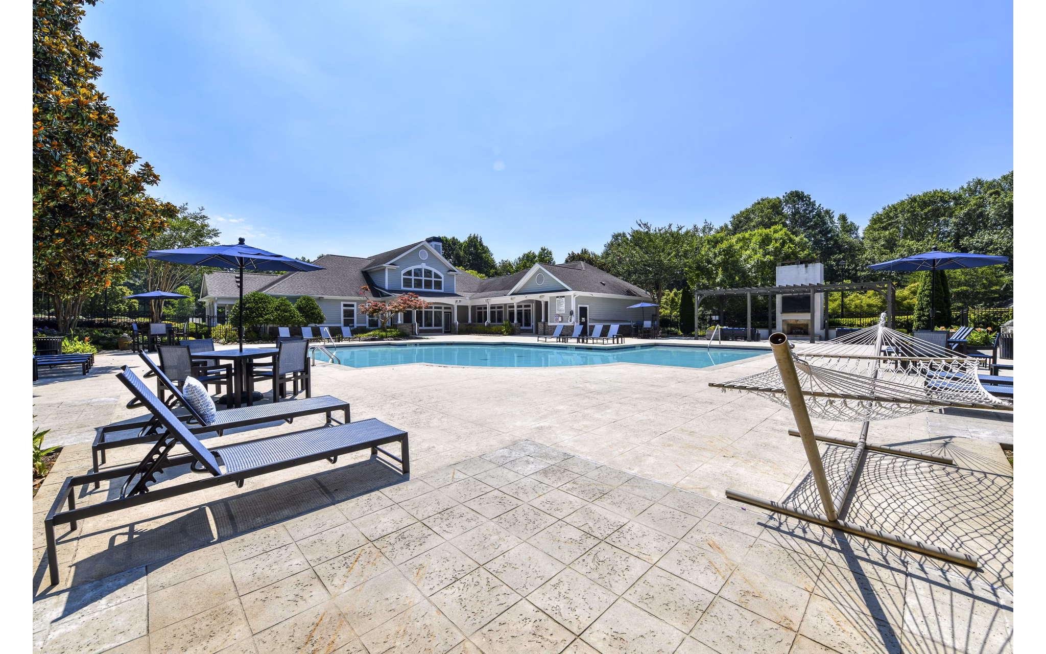 Inviting pool with lounge chairs at Avana North Point Apartments, offering a relaxing retreat at luxury Greystar residences