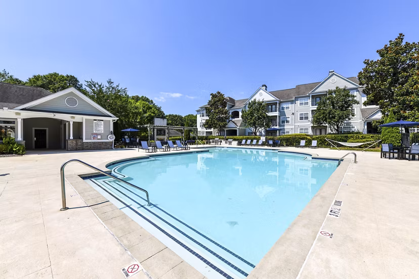 Resort-style pool with sundeck at Avana North Point Apartments, a luxury living community offering modern amenities