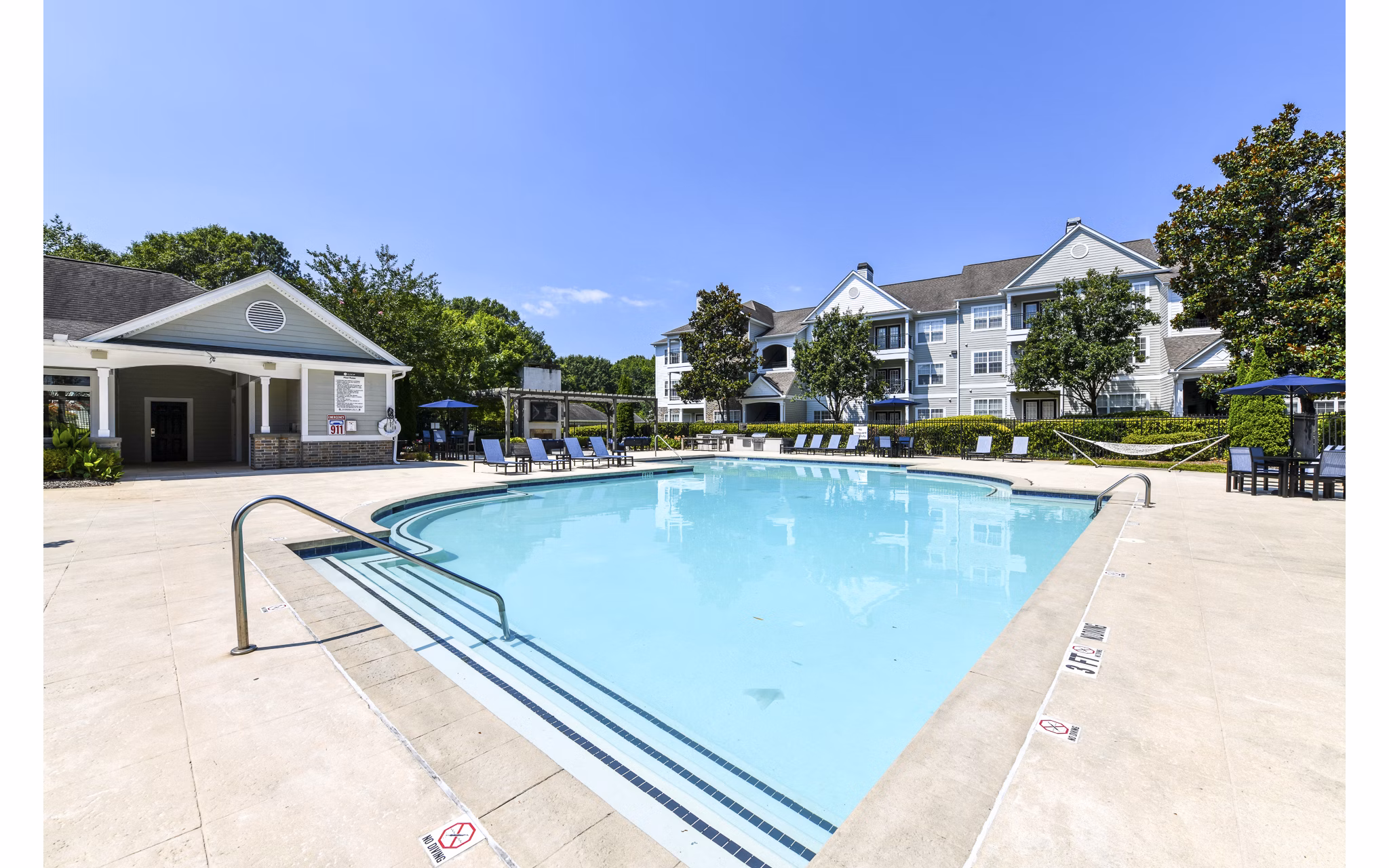 Resort-style pool with sundeck at Avana North Point Apartments, a luxury living community offering modern amenities