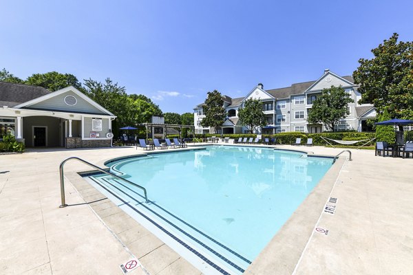 Resort-style pool with sundeck at Avana North Point Apartments, a luxury living community offering modern amenities