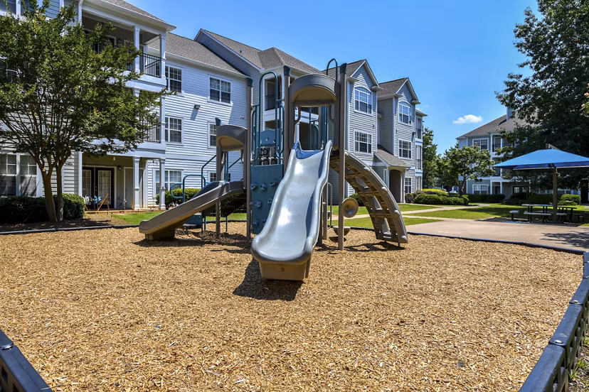 Modern playground with vibrant play structures at Avana North Point Apartments for resident enjoyment
