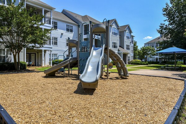 Modern playground with vibrant play structures at Avana North Point Apartments for resident enjoyment