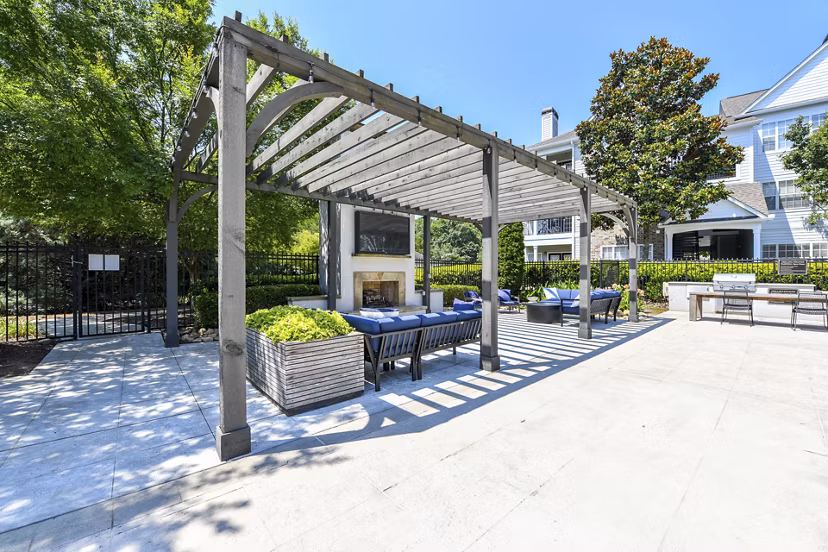Serene courtyard at Avana North Point Apartments with lush landscaping and cozy seating areas for relaxation and gathering