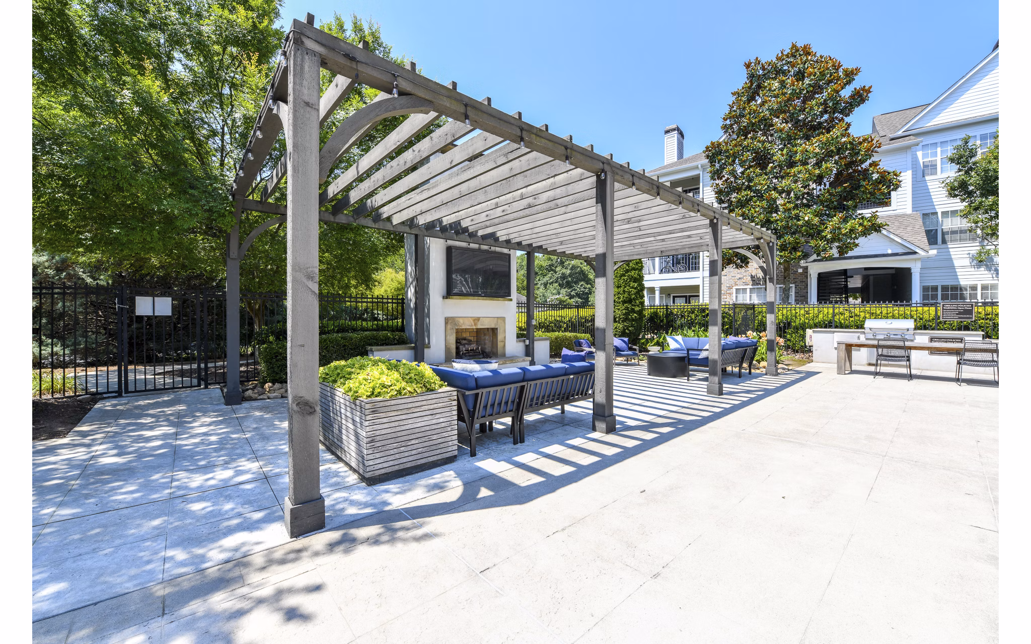 Serene courtyard at Avana North Point Apartments with lush landscaping and cozy seating areas for relaxation and gathering