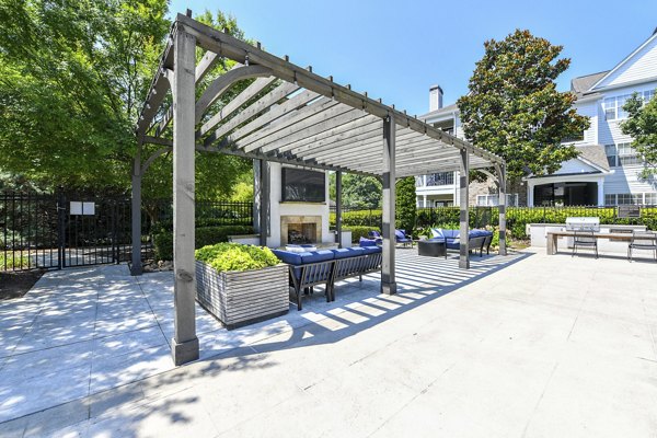 Serene courtyard at Avana North Point Apartments with lush landscaping and cozy seating areas for relaxation and gathering