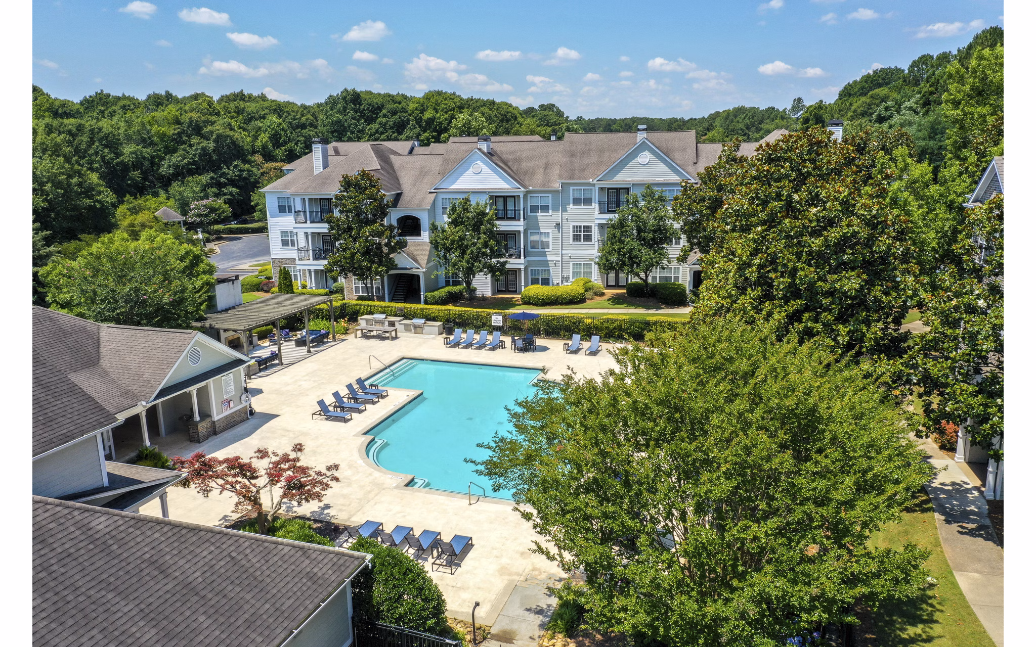 Scenic view of Avana North Point luxury apartments in a vibrant neighborhood, showcasing modern architectural design and lush greenery