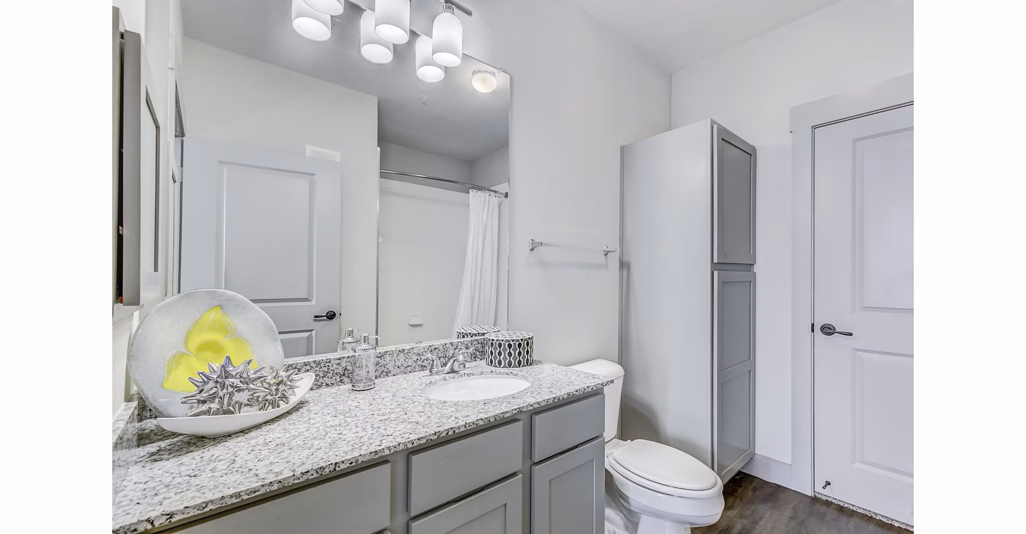 Modern bathroom with sleek fixtures and marble countertops at Landmark on Lovers Apartments